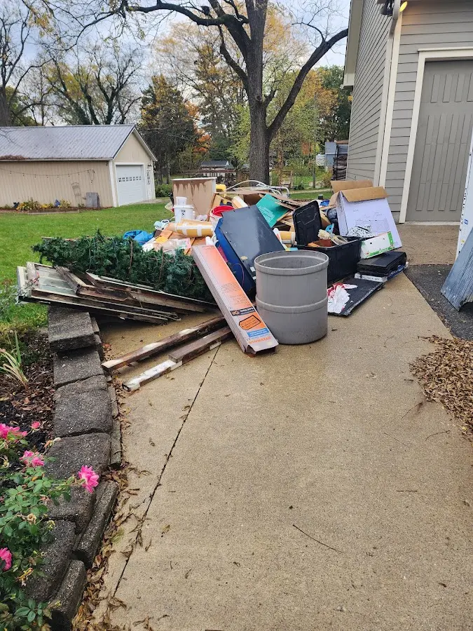 Dumpster being loaded with debris for Commercial Dumpster Rental in Sylacauga